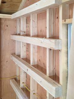 the shelves are made out of wood and ready to be built into the house's walls