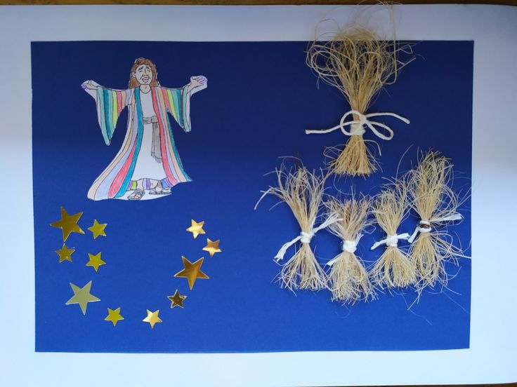 an image of the nativity scene made out of wheat stalks and star decorations on a blue background