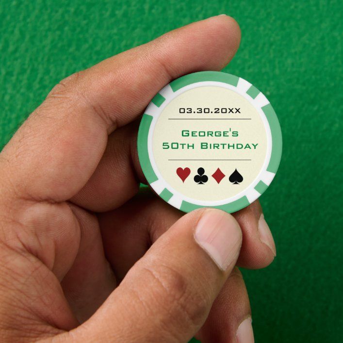 a hand holding a green and white casino chip birthday card that reads george's 50th birthday