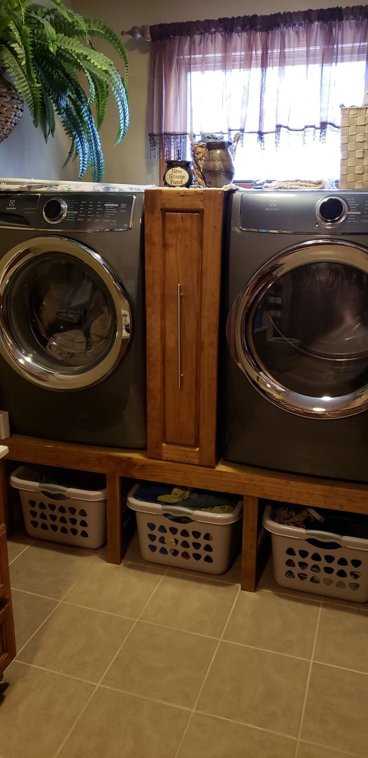 a washer and dryer are stacked on top of each other