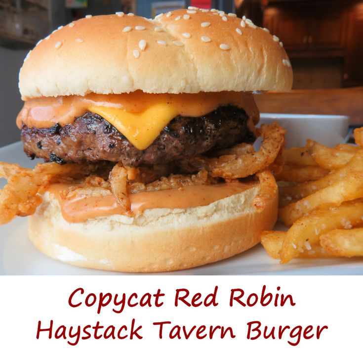 a cheeseburger and fries on a plate with the words copycat red robin haustack tavern burger