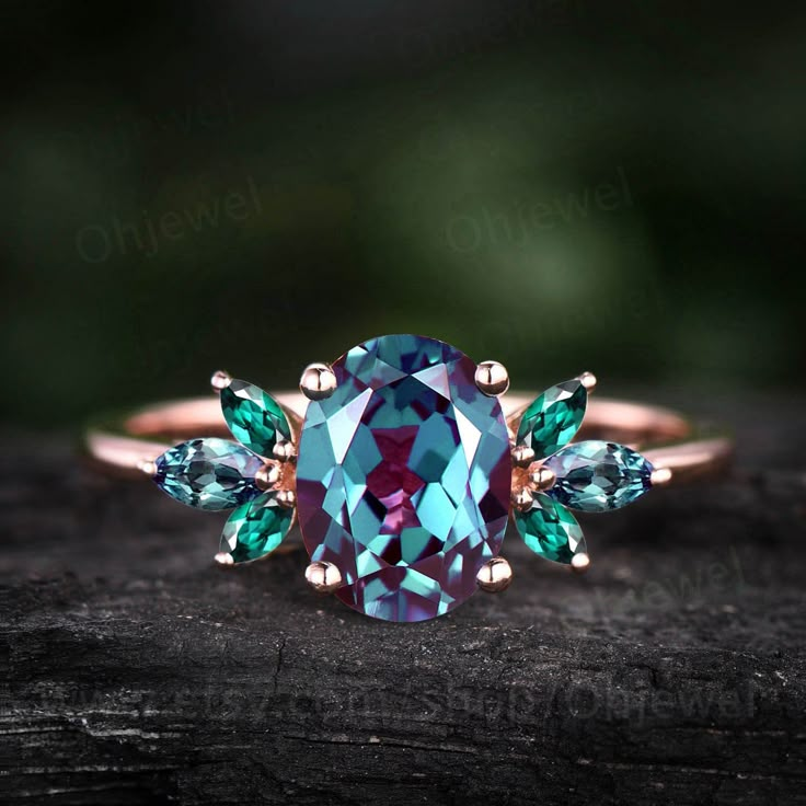 "This is a 1.3 carat Lab treated alexandrite engagement ring in solid gold,about 6X8mm oval cut. The accent stones are marquise emeralds+alexandrite.( moonstones and opals or Moonstone+moissanites). It can be made in any ring size. However please contact me to custom make it to a special big or small size. It can be made in white gold,rose gold or yellow gold with 14k or 18k. However for some people who are nickel allergic,I can also make it to 925 sterling silver to make you can wear it. The ri Emerald And Alexandrite Engagement Ring, Vintage Anniversary Rings, Vintage Anniversary, Opal Ring Vintage, Emerald Ring Vintage, Alexandrite Engagement Ring, Alexandrite Ring, Dream Engagement Rings, Ring Women