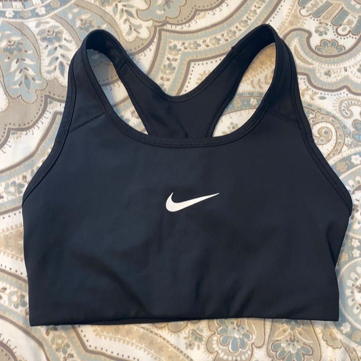 New, Never Worn Sports Bra. Nike. Black Sports Bra For Light Exercise, Black Activewear For Light Exercise During Sports Season, Nike Black Activewear For Sports, Black Athletic Fit Sports Bra For Sports Season, Nike Black Sports Bra For Sports Events, Nike Black Sports Bra For Athletics, Casual Black Sports Bra With Built-in Padding, Black Nike Sports Bra For Sports, Fitted Black Nike Sports Bra