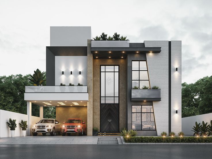 two cars are parked in front of a modern house with lights on the windows and balconies