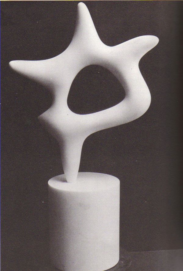 a white sculpture sitting on top of a table