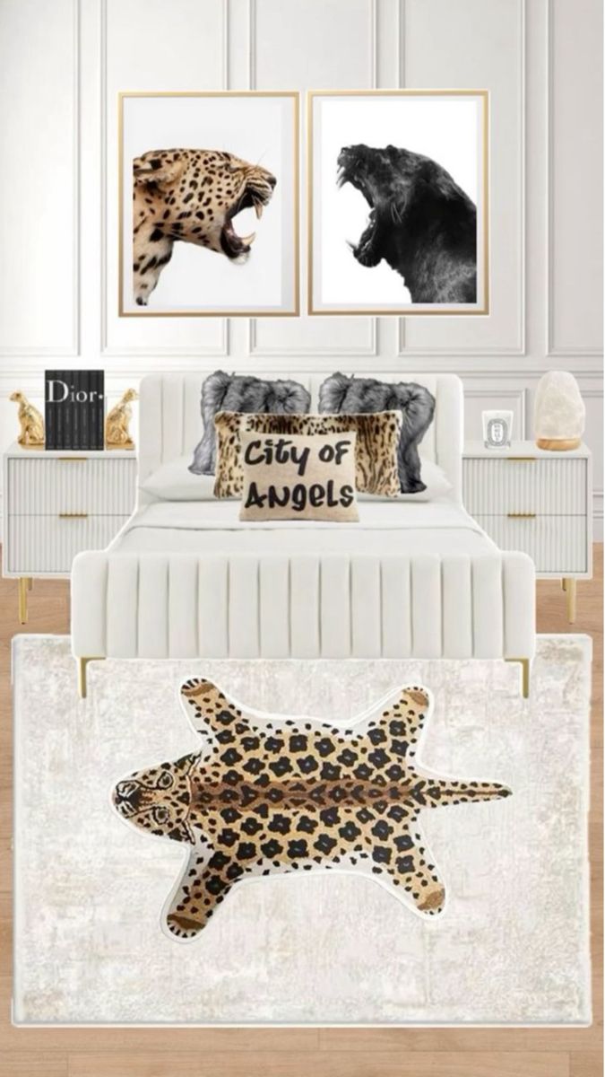 a bed with two pictures on the wall above it and an animal pillow in the middle