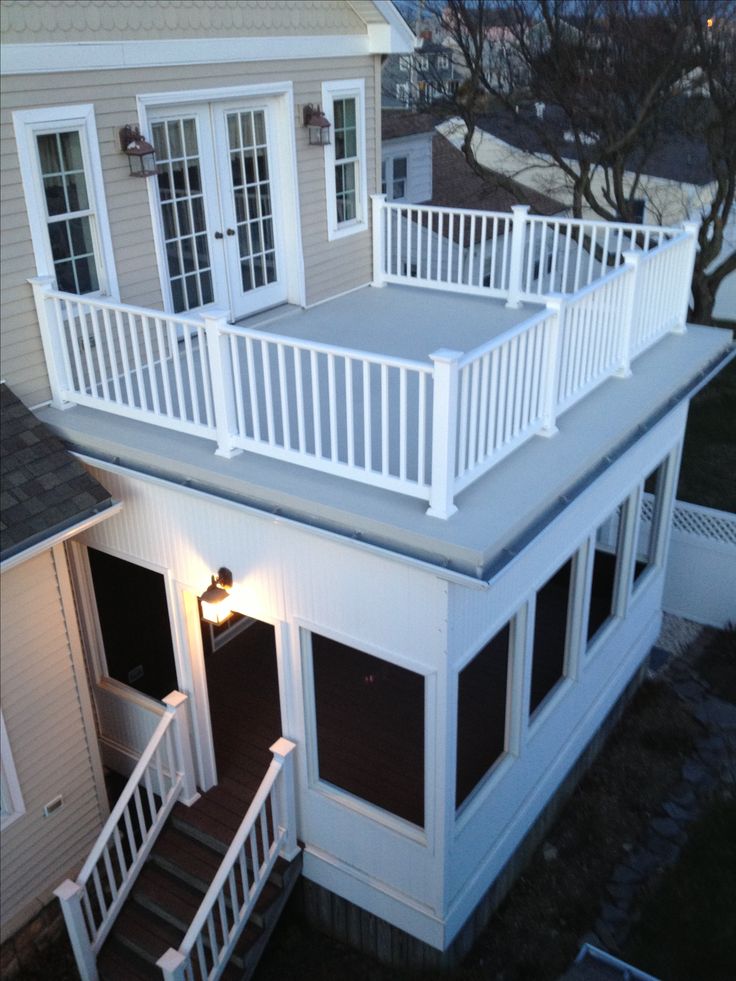 an aerial view of a house with stairs leading up to the upper level and second story