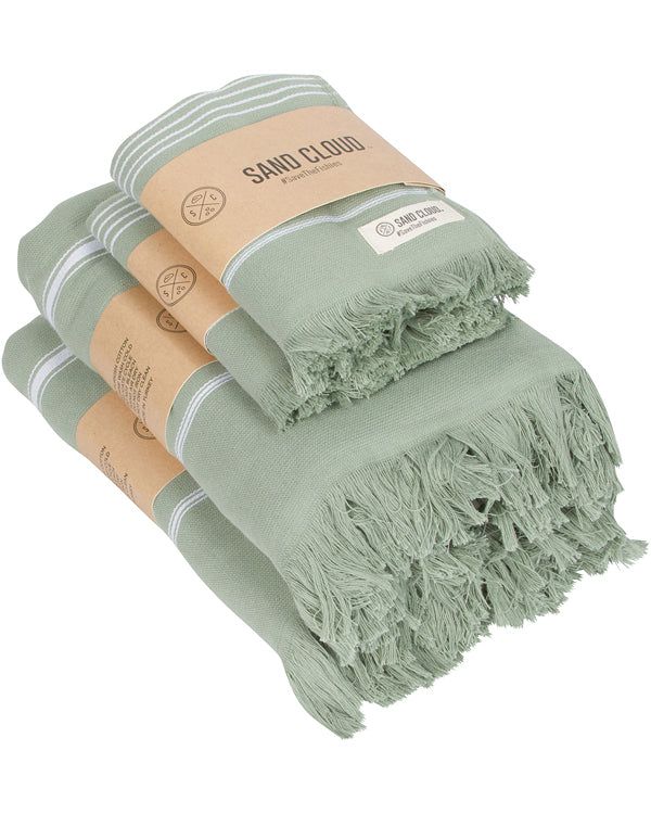 three green towels stacked on top of each other with the label sambuli in front of them