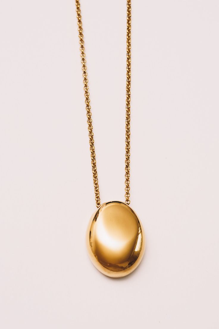 This minimal necklace has a mirrored finish with a high polish shine to add subtle sophistication to any look. Dimensions: Hangs 28" including pendant (1.25") (32mm) Materials: Stainless Steel, 18k Gold plating Ships in a branded jewelry pouch and box, perfect for gift giving! Modern Chain Necklace With Polished Finish For Everyday, Modern Polished Chain Necklace For Everyday, Modern Teardrop Pendant Necklace Tarnish Resistant, Modern Gold Plated Oval Pendant Necklace, Modern Gold Necklace With Teardrop Pendant, Everyday Gold Necklaces With Polished Finish, Modern Tarnish Resistant Pendant Chain Necklace, Modern Gold Teardrop Pendant Jewelry, Modern Gold Teardrop Pendant Necklace