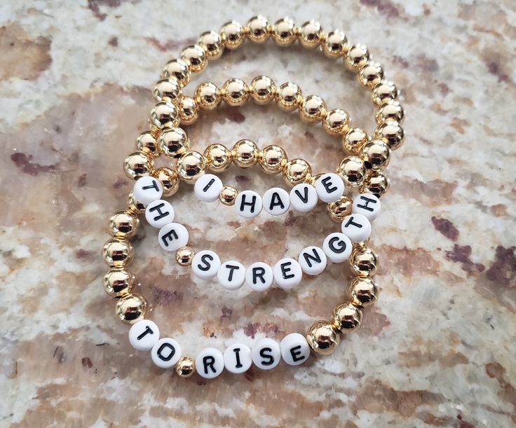 This is our new Affirmation Collection.  Made of beautiful 18k gold filled beads.. You can message me with your favorite quote or affirmation and we will turn it into a beautiful bracelet set suitable for daily wear so you can be reminded every day of what's meaningful and what can help you get through your day.  Message me with any questions . Thanks for stopping by Happy Shopping Bracelets stretch to fit 6 1/2 to 7" standard size wrists. Message me if you need it resized and I will do at no co Gold Personalized Spiritual Beaded Bracelets, Gold Adjustable Beaded Bracelets With Meaningful Style, Gold Beaded Bracelets For Everyday With Meaningful Style, Gold Beaded Bracelets For Everyday Meaningful Style, Meaningful Gold Beaded Bracelets For Gifts, Meaningful Gold Beaded Bracelets As Gift, Gold Beaded Bracelets For Everyday, Meaningful Gold Beaded Bracelet For Gifts, Meaningful Gold Bracelets With Round Beads