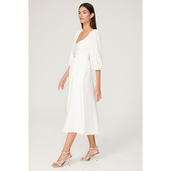 White cotton blend (96% Organic Cotton, 4% Spandex). A-line. 3/4 sleeves. Sweetheart. Imported. Feminine Midi Dress With 3/4 Sleeves, Chic White Half Sleeve Dress, Elegant Spring Midi Dress With 3/4 Sleeves, Chic Spring Midi Dress With Half Sleeve, Chic Midi Dress With Half Sleeves For Spring, Chic Midi Dress With 3/4 Sleeve For Day Out, White Midi Dress With 3/4 Sleeves For Brunch, White Long Sleeve Fit And Flare Midi Dress, Fitted Half Sleeve Midi Dress For Spring