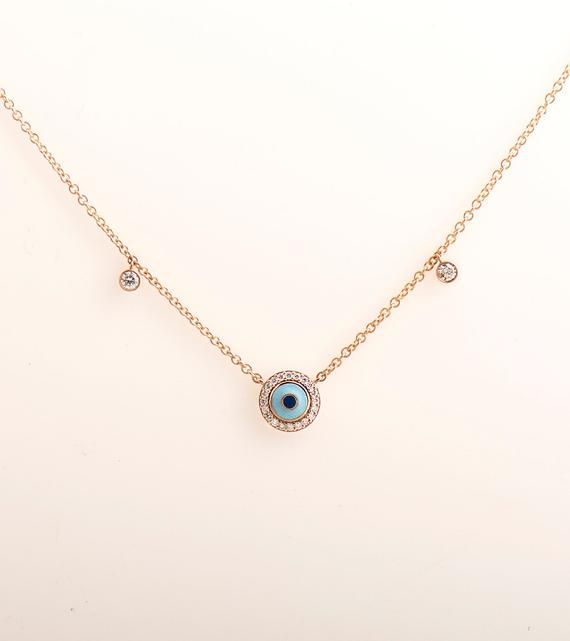 Evil eye penadant made in 14k or 18k rose gold and set with clear diamonds.Diamonds surrounding the eye and 2 additional diamonds on each side of the chain.The eye color is made in enamel coating process and can be made in other colors as wellThis listing is for ROSE GOLD, you can order other colours from the following links:● Yellow gold - ● White gold - DIAMONDS SPECIFICATIONSTotal Carat Weight: 0.30 CTColor: G +Clarity: VS +Shape: RoundThe stones are 100% natural diamonds and conflict free di 14k Rose Gold Single Cut Diamonds Jewelry, 14k Rose Gold Jewelry With Diamond Eyes, Rose Gold Diamond Jewelry With Diamond Eyes, Rose Gold 14k Diamond Eyes Jewelry, Yellow Gold Diamond Jewelry With Evil Eye, Rose Gold Sterling Silver Jewelry With Evil Eye, Sterling Silver Rose Gold Evil Eye Jewelry, Elegant Rose Gold Evil Eye Jewelry, Sterling Silver Evil Eye Jewelry In Rose Gold