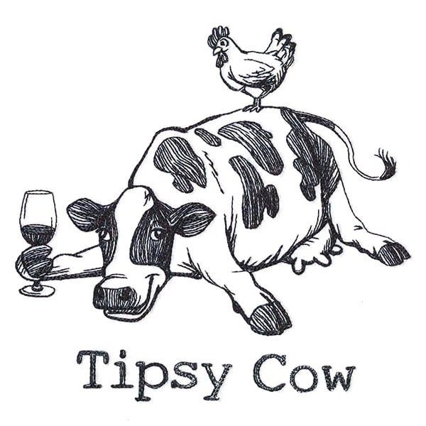 a drawing of a cow laying down with a glass of wine in its mouth and the words tipsy cow written below it