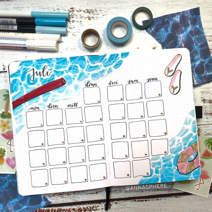 a calendar with scissors and some other items on it