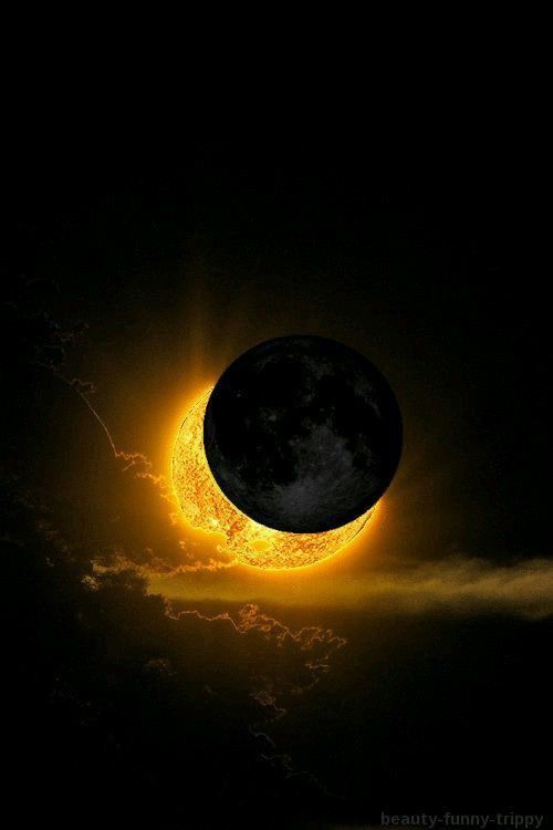 an eclipse in the sky with clouds and sun behind it, as seen from space