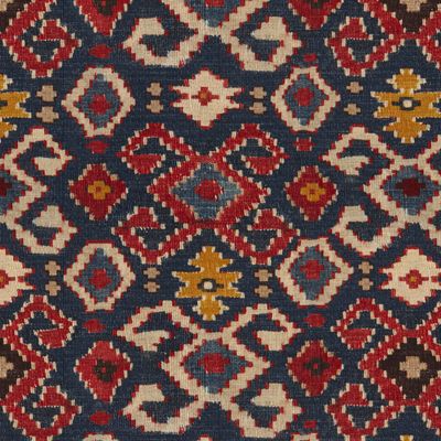 an old rug with many different colors and patterns