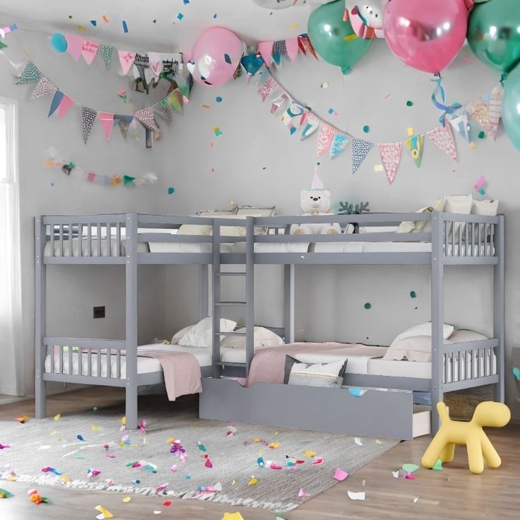 a bedroom decorated with balloons and confetti on the ceiling, two bunk beds