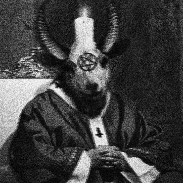 a goat with horns is wearing a robe