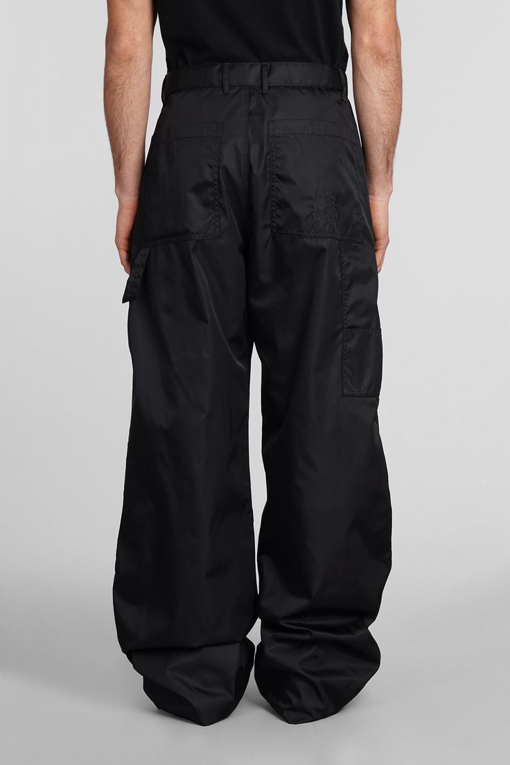 Pants In Black Polyamide Black Utility Style Wide Leg Full Length Pants, Utility Style Black Wide Leg Full Length Pants, Black Bottoms With Functional Pockets, Black Full Length Utility Wide Leg Pants, Wide Leg Nylon Pants For Streetwear, Relaxed Fit Bottoms With Functional Pockets, Full Length Pants With Functional Pockets, Black Nylon Cargo Pants For Work, Black Tapered Leg Pants With Functional Pockets