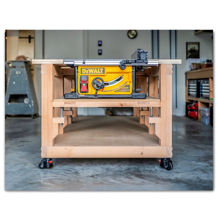 a workbench with a table saw on it in a garage or repair shop