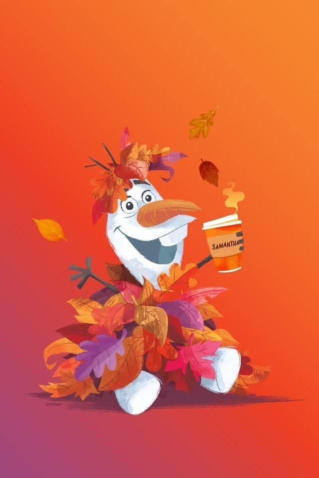 a cartoon character holding a cup with autumn leaves on it