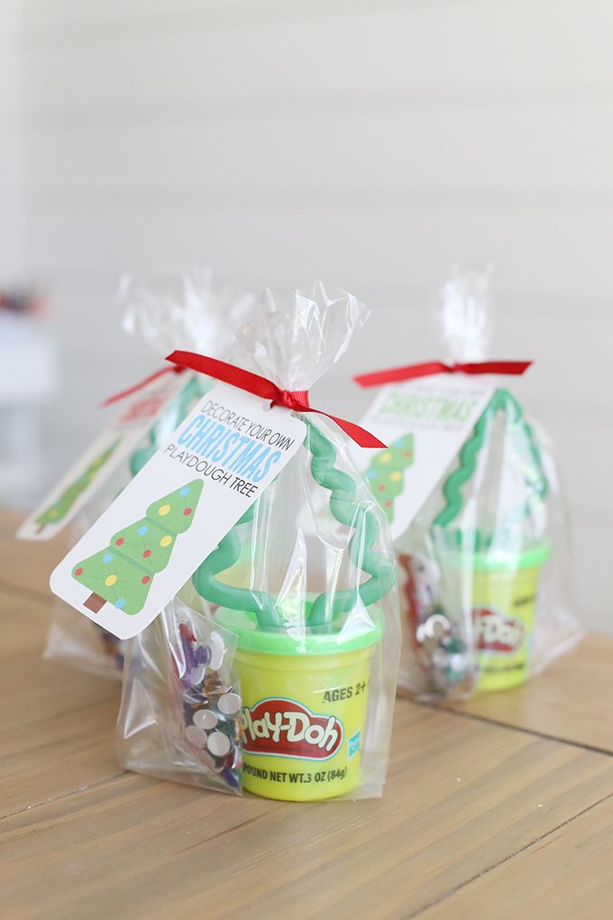 two plastic bags filled with ice cream sitting on top of a wooden table next to each other