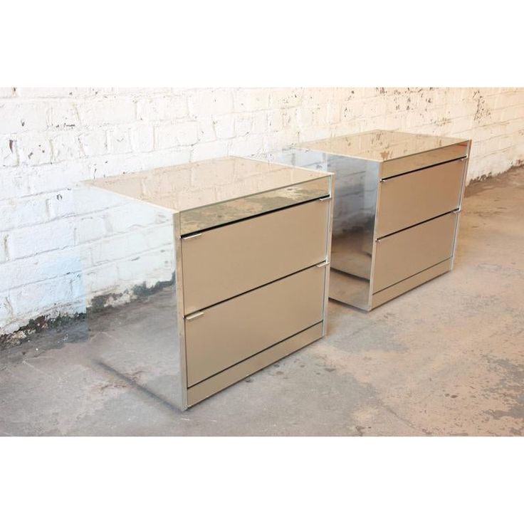 two metal filing cabinets sitting next to each other