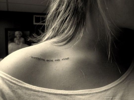 a woman with a tattoo on her back saying everything you can see is true love