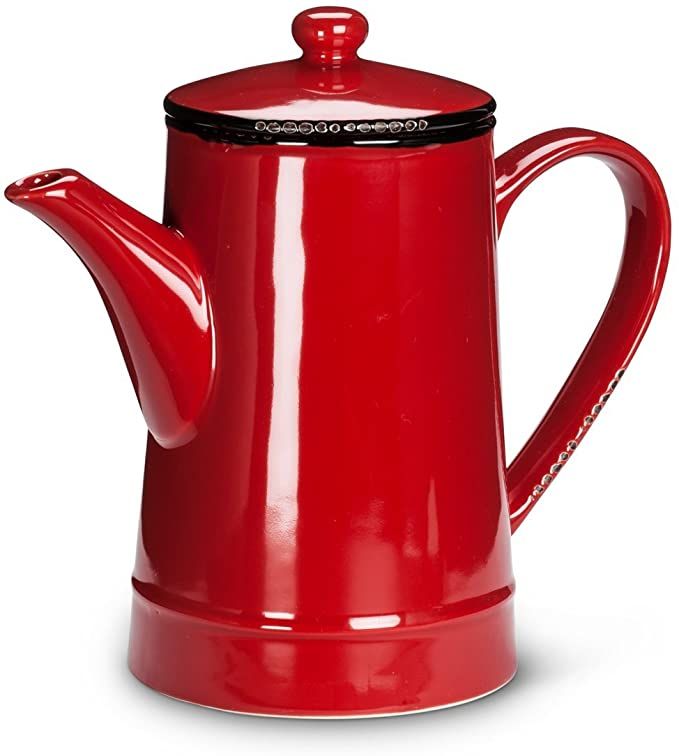 a red teapot with a black lid and handle on a white background is shown