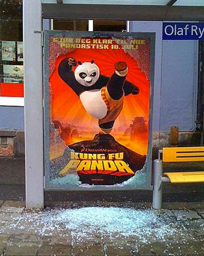 an advertisement for the movie's animated film, king fu panda is displayed in front of a bus stop