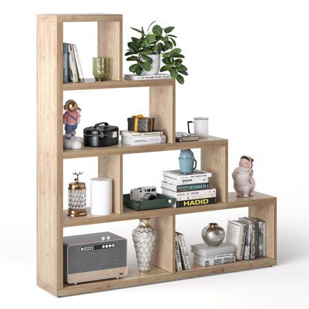 a book shelf filled with books and other items on top of eachother in front of a white background