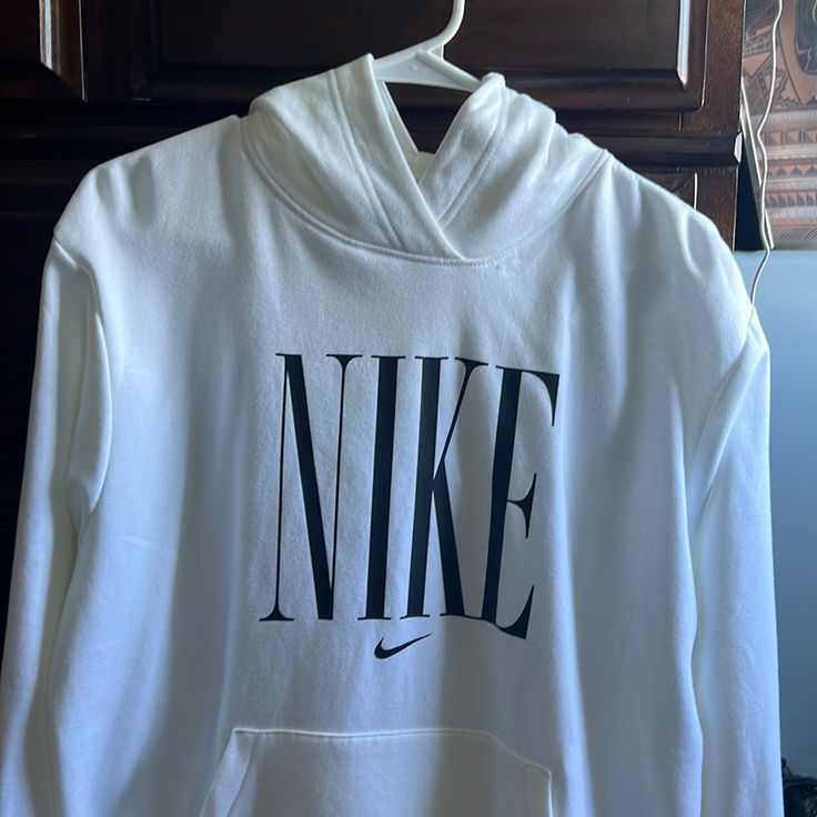 Ladies Nike Pullover Never Worn. Brand New. White Logo Print Sweater For Fall, White Logo Print Sweater For Spring, White Sweater With Logo Print For Spring, White Letter Print Sweater For Spring, Nike White Sweatshirt With Logo Print, Nike White Sweatshirt With Letter Print, Nike White Graphic Print Sweatshirt, White Athleisure Sweater For Fall, Nike White Hoodie For Fall