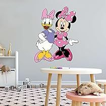 a child's room with a mickey and minnie mouse wall decal on the wall