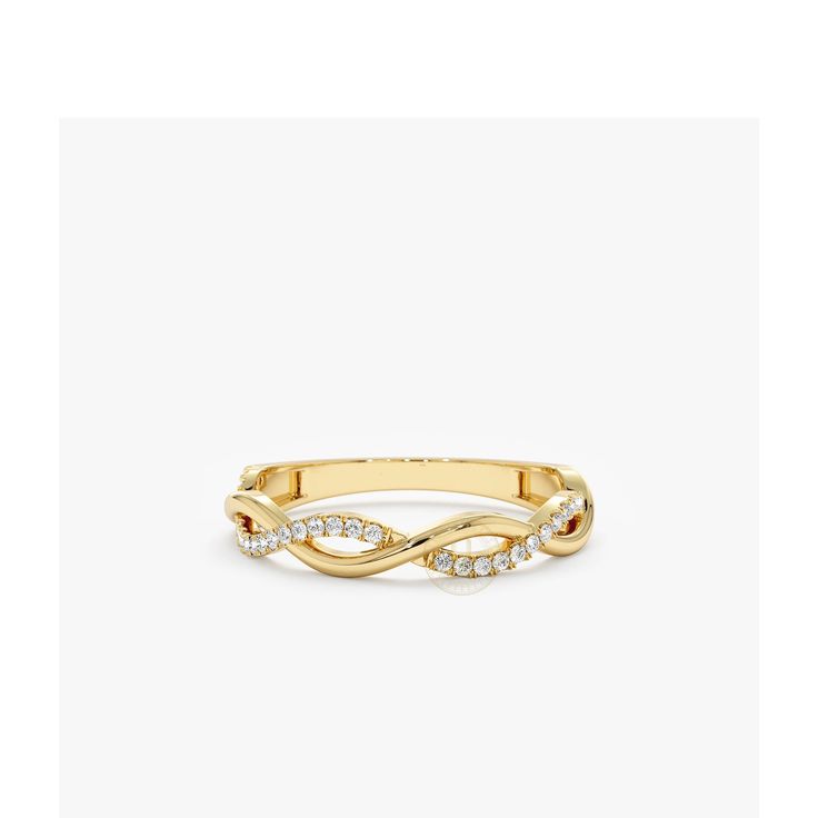 a yellow gold ring with diamonds on the sides and an intertwined design in the middle