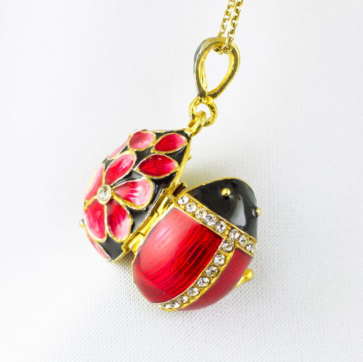 "Locket Ladybug with the guardian angel inside, enameled and 24K gold plated over solid sterling silver, created in the spirit and tradition of Faberge jewelry in our NJ shop. The front of the pendant is designed as a bug with a black head and red wings and in the back large pink - red flowers emerge from the black surface. High quality clear crystals are set at the center of the flowers and in the lines separating the head and the wings  from each other.   The pendant is about 0.9\" (20 mm ) wi Red Flower Necklace, Faberge Jewelry, Jewelry Lockets, Pretty Pendant, Jewelry For Her, Guardian Angel, Enamel Jewelry, Lucky Charm, Turquoise Jewelry