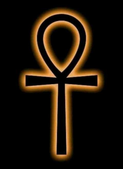 an orange and black symbol on a black background in the shape of an egyptian cross