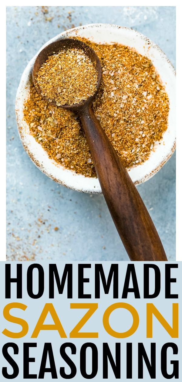 homemade sazonni seasoning in a white bowl with a wooden spoon on top