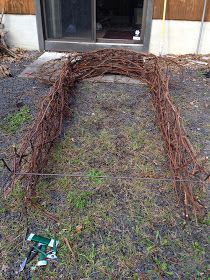 an outdoor sculpture made out of branches