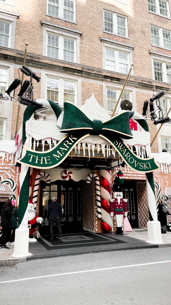 an outdoor christmas display in front of a building