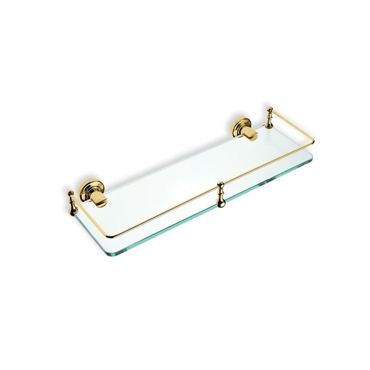 a glass shelf with two brass handles on the top and one is holding a soap bar