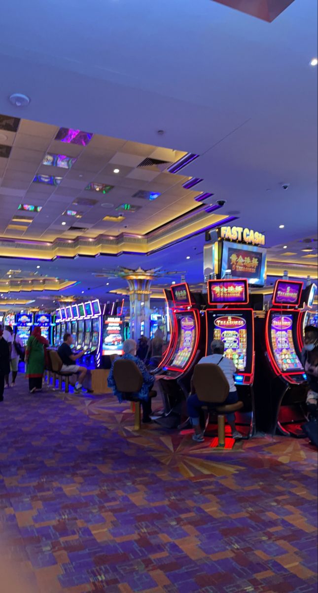 a casino room filled with lots of slot machines