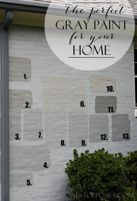 a white brick house with the words gray paint for your home painted on it's side