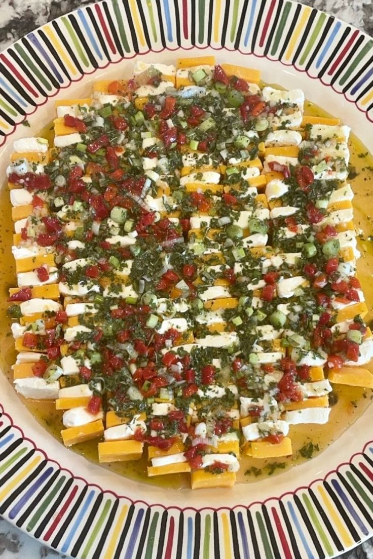 a platter filled with lots of food on top of a table