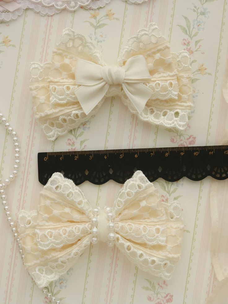 Elevate your kawaii look with our 2 options beige sweet bowknot hairclip. This charming hair accessory features a delicate bowknot design in a soft beige color, adding a touch of sweetness to any outfit. Whether you're aiming for a Lolita-inspired style or simply want to add a cute accent to your look, this hairclip is the perfect choice.   Please note that this product includes only the hairclip. Complete your kawaii ensemble with this adorable hairclip today! Cute Ribbon Bow For Wedding, Cute White Bow With Ribbon, Cute White Ribbon Bow, Cute White Bow Tie Hair Accessories, White Cute Hair Accessories With Bow Tie, Cute White Hair Accessories With Bow Tie, Cute White Hair Accessories With Pink Bow, Cute Wedding Hair Accessories With Decorative Bow, Soft Beige Color