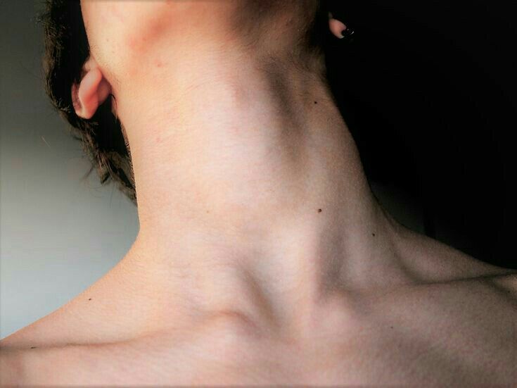 the back of a man's neck with no shirt on