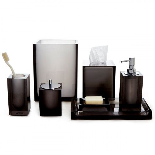 bathroom accessories including soap dispenser, toothbrush holder and tissue dispenser