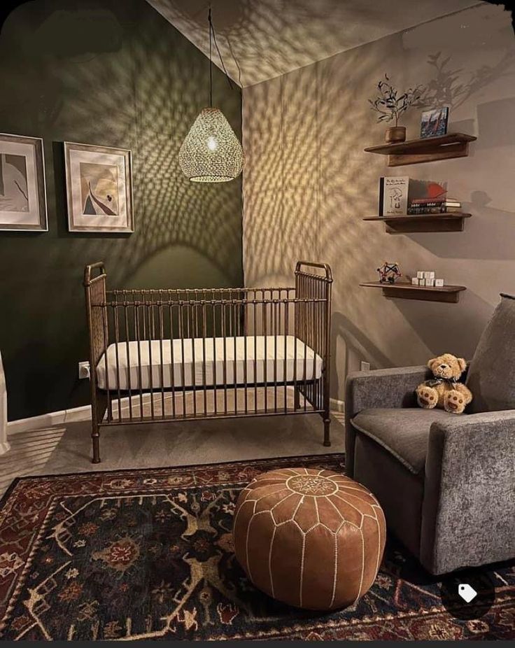 a baby's room with a crib, chair and ottoman