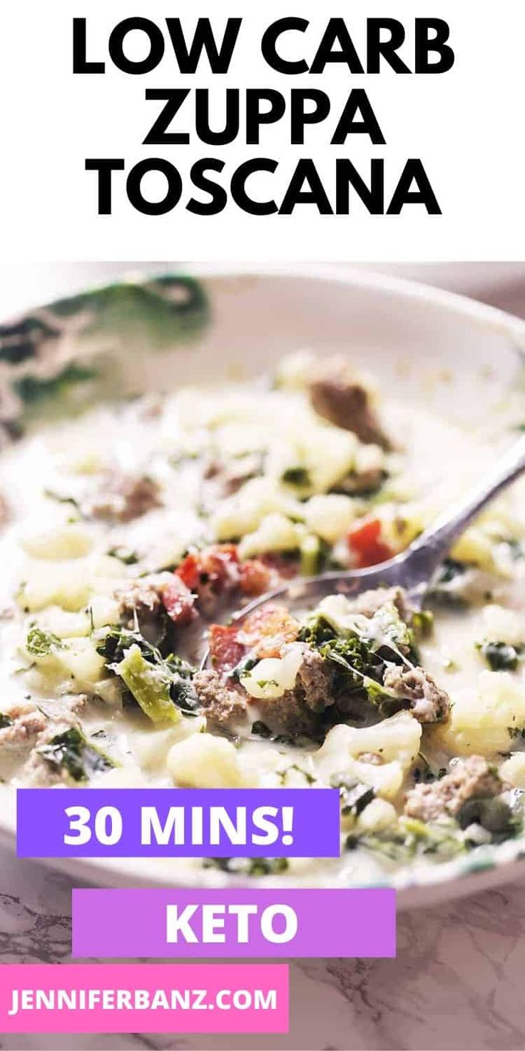 a bowl of soup with broccoli, cheese and meat in it next to a spoon