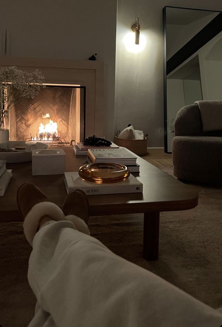 a living room filled with furniture and a fire place