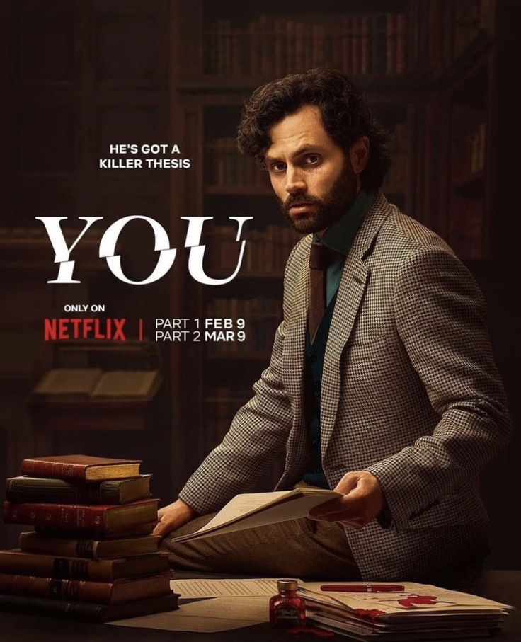 a man sitting at a table with books in front of him and the words you on it